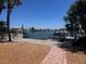 The waterfront backyard of this property offers serene water views and private dock access at 510 64Th Ave, St Pete Beach, FL 33706