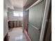 Image of unfinished bathroom with removed cabinetry, pink tile floors and a standing shower stall at 510 64Th Ave, St Pete Beach, FL 33706
