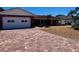 Charming single-story home featuring a two-car garage and a beautiful brick driveway at 510 64Th Ave, St Pete Beach, FL 33706