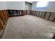 Image of unfinished room with flooring removed, framing exposed and windows facing street at 510 64Th Ave, St Pete Beach, FL 33706