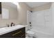Cozy bathroom showcases white bathtub and dark vanity with gold hardware at 5193 Higate Rd, Spring Hill, FL 34609