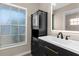 Modern bathroom featuring vanity with new fixtures and a frosted window at 5193 Higate Rd, Spring Hill, FL 34609