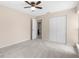Carpeted bedroom featuring ceiling fan, closet, and neutral paint color at 5193 Higate Rd, Spring Hill, FL 34609