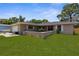Well-maintained home with a lovely front lawn and inviting curb appeal at 5193 Higate Rd, Spring Hill, FL 34609