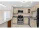 Beautiful kitchen with stainless steel appliances, light-colored cabinets, and modern fixtures at 5193 Higate Rd, Spring Hill, FL 34609