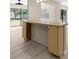 Elegant kitchen bar with granite countertop, cabinets and connection to living room at 5193 Higate Rd, Spring Hill, FL 34609