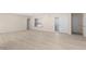 Bright and spacious living room, with new flooring and access to the backyard, with window at 5193 Higate Rd, Spring Hill, FL 34609