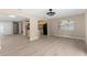 Open-concept living space showcasing a kitchen and window views at 5193 Higate Rd, Spring Hill, FL 34609