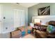 Bedroom featuring tile flooring, ample closet storage, an oversized chair and stacked moving boxes at 5267 81St N St # 8, St Petersburg, FL 33704