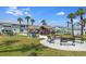 Scenic view of a community common area featuring picnic tables, benches, and lush landscaping at 5267 81St N St # 8, St Petersburg, FL 33704