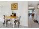Cozy dining area with modern chairs and a wood table adjacent to the kitchen at 5267 81St N St # 8, St Petersburg, FL 33704