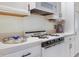 Bright kitchen features white appliances, cabinetry, counters, and dark hardware at 5267 81St N St # 8, St Petersburg, FL 33704