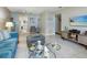 Bright living room with tile floors, modern decor, and comfortable seating arrangement at 5267 81St N St # 8, St Petersburg, FL 33704