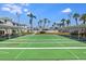 Active shuffleboard courts surrounded by palm trees, benches, and covered seating areas at 5267 81St N St # 8, St Petersburg, FL 33704