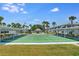 Scenic view of shuffleboard courts with covered seating areas and tropical landscaping at 5267 81St N St # 8, St Petersburg, FL 33704