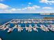 Aerial view of a marina with multiple boats docked and a beautiful waterfront view at 5823 Bowen Daniel Dr # 906, Tampa, FL 33616