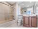 Bathroom featuring a glass enclosed shower, single sink vanity and tile flooring at 5823 Bowen Daniel Dr # 906, Tampa, FL 33616