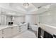 Modern bathroom with double vanity, freestanding tub, rainfall shower head and statement mirror at 5823 Bowen Daniel Dr # 906, Tampa, FL 33616