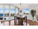 Bright dining area featuring large windows showcasing city and water views, complemented by a stylish chandelier at 5823 Bowen Daniel Dr # 906, Tampa, FL 33616