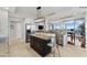 Spacious kitchen with a center island, stainless steel appliances, and a seamless transition to the dining area with stunning views at 5823 Bowen Daniel Dr # 906, Tampa, FL 33616