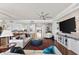 Bright and open living area with modern decor, leading to the kitchen at 5823 Bowen Daniel Dr # 906, Tampa, FL 33616