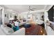 Bright, airy living room leading to a dining area, showcasing an open floor plan at 5823 Bowen Daniel Dr # 906, Tampa, FL 33616