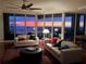 Beautiful living room featuring floor-to-ceiling windows offering gorgeous sunset views and modern stylish furniture at 5823 Bowen Daniel Dr # 906, Tampa, FL 33616