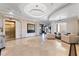 Expansive lobby with travertine floors, elegant furnishings, and elevator access at 5823 Bowen Daniel Dr # 906, Tampa, FL 33616