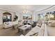 Bright lobby with stylish seating, expansive windows, and a view of the neighborhood at 5823 Bowen Daniel Dr # 906, Tampa, FL 33616