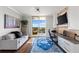 Home office featuring a hardwood floor, desk and a private balcony at 5823 Bowen Daniel Dr # 906, Tampa, FL 33616