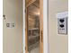 Inside view of a wood sauna with wooden benches and temperature control panel at 5823 Bowen Daniel Dr # 906, Tampa, FL 33616