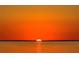Spectacular sunset view over the calm ocean, highlighting the tranquil water and serene horizon at 5823 Bowen Daniel Dr # 906, Tampa, FL 33616