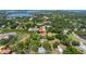 Aerial view of the home surrounded by trees and greenery in a secluded neighborhood at 592 Ken Hubbard Rd, Terra Ceia, FL 34250