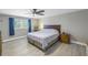 Comfortable bedroom with ceiling fan, window, and dresser. Ready for relaxation at 592 Ken Hubbard Rd, Terra Ceia, FL 34250