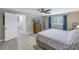 Inviting bedroom with a ceiling fan, window view, and ample space for furniture at 592 Ken Hubbard Rd, Terra Ceia, FL 34250