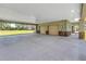 Spacious covered parking area with multiple garage doors and ample space, perfect for vehicle storage and easy access at 592 Ken Hubbard Rd, Terra Ceia, FL 34250