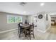 Dining room with wood table and view of kitchen at 592 Ken Hubbard Rd, Terra Ceia, FL 34250