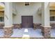 Grand entrance featuring double doors, stone accents, and ample space, creating a welcoming and elegant facade at 592 Ken Hubbard Rd, Terra Ceia, FL 34250
