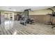 Spacious exercise room with wood-look flooring and ample space for workout equipment at 592 Ken Hubbard Rd, Terra Ceia, FL 34250