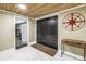 Bright foyer showcasing double doors, a wood plank ceiling, marble floors, and a console table at 592 Ken Hubbard Rd, Terra Ceia, FL 34250