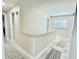 Bright hallway features stylish flooring, updated paint, and natural light from the window at 592 Ken Hubbard Rd, Terra Ceia, FL 34250