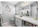 Bright bathroom with white vanity, large mirror, and decorative accents at 6507 61St E Dr, Palmetto, FL 34221