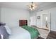 Tranquil bedroom with wood floors, light walls, and a comfortable bed at 6507 61St E Dr, Palmetto, FL 34221