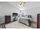 Bright bedroom with a ceiling fan, neutral paint, and a cozy rug on the floor at 6507 61St E Dr, Palmetto, FL 34221