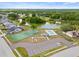 Aerial view highlighting the community's amenities, including a pool, playground, and tennis courts at 6507 61St E Dr, Palmetto, FL 34221
