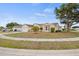 Charming single-story home featuring a manicured lawn, mature trees, and a two-car garage at 6507 61St E Dr, Palmetto, FL 34221