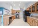 Spacious kitchen with stainless steel appliances, tile backsplash, and ample cabinet space at 6507 61St E Dr, Palmetto, FL 34221
