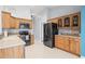Bright kitchen featuring stainless steel appliances and wood cabinetry at 6507 61St E Dr, Palmetto, FL 34221