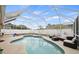 Beautiful kidney-shaped screened-in pool with ample deck space for entertaining and relaxing at 6507 61St E Dr, Palmetto, FL 34221