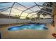 Relaxing screened-in pool with a covered lanai and plenty of seating for entertaining at 6507 61St E Dr, Palmetto, FL 34221
